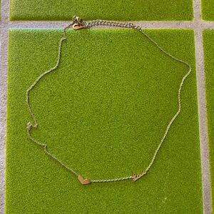 Gold necklace with love and heart
